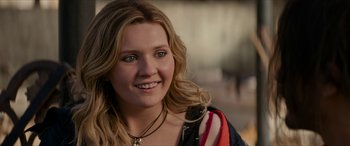 Movie still from “Zombieland: Double Tap” (2019), directed by Ruben Fleischer – A person wearing a necklace; Close Up shot, Over the shoulder angle