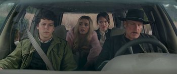 Movie still from “Zombieland: Double Tap” (2019), directed by Ruben Fleischer – A group of people sitting in the back of a car; Medium shot, Over the shoulder angle