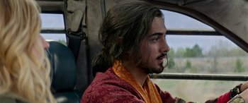 Movie still from “Zombieland: Double Tap” (2019), directed by Ruben Fleischer – A person with long brown hair; Close Up shot, Over the shoulder angle