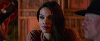 Movie still from “Zombieland: Double Tap” (2019), directed by Ruben Fleischer – A person sitting in a chair; Close Up shot, Over the shoulder angle