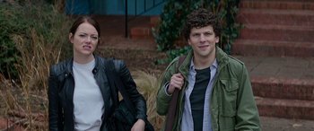 Movie still from “Zombieland: Double Tap” (2019), directed by Ruben Fleischer – A man and a woman standing next to each other outside; Medium shot, Over the shoulder angle