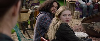 Movie still from “Zombieland: Double Tap” (2019), directed by Ruben Fleischer – A man and a woman sitting next to each other; Medium shot, Over the shoulder angle