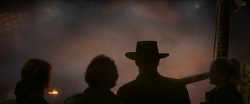 Movie still from “Zombieland: Double Tap” (2019), directed by Ruben Fleischer – A man and a woman are silhouetted against the sky; Medium shot, Low angle