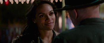 Movie still from “Zombieland: Double Tap” (2019), directed by Ruben Fleischer – A person smiling at the camera; Close Up shot, Over the shoulder angle