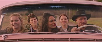 Movie still from “Zombieland: Double Tap” (2019), directed by Ruben Fleischer – A group of people in the back of a pink car; Medium shot, Over the shoulder angle