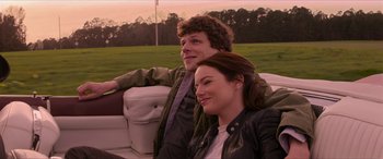 Movie still from “Zombieland: Double Tap” (2019), directed by Ruben Fleischer – A man and a woman sitting in a car; Medium shot, Over the shoulder angle