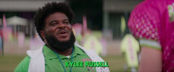 Movie still from “Zombies 3” (2022), directed by Paul Hoen – A person wearing a green shirt; Close Up shot, High angle