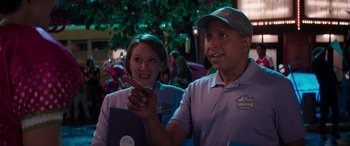 Movie still from “Zombies 3” (2022), directed by Paul Hoen – A man and a woman sitting next to each other; Medium shot, Over the shoulder angle