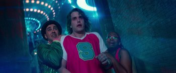 Movie still from “Zombies 3” (2022), directed by Paul Hoen – A group of men standing next to each other in a room; Medium shot, Low angle