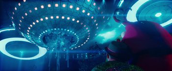 Movie still from “Zombies 3” (2022), directed by Paul Hoen – A man standing in front of an illuminated ceiling; Extreme Wide shot, Low angle