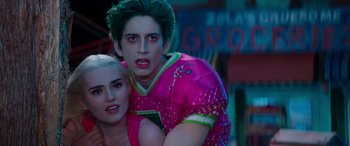 Movie still from “Zombies 3” (2022), directed by Paul Hoen – A man and a woman are posing for a picture; Close Up shot, Over the shoulder angle