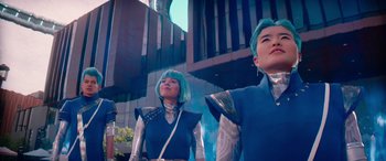 Movie still from “Zombies 3” (2022), directed by Paul Hoen – A couple of people standing next to each other on top of a building; Medium shot, Low angle