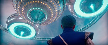 Movie still from “Zombies 3” (2022), directed by Paul Hoen – A man looking up at a light show in the sky; Wide shot, Low angle