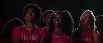 Movie still from “Zombies 3” (2022), directed by Paul Hoen – A group of young people standing in a dark room; Close Up shot, Low angle