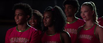 Movie still from “Zombies 3” (2022), directed by Paul Hoen – A group of young people standing next to each other; Close Up shot, Over the shoulder angle