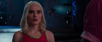 Movie still from “Zombies 3” (2022), directed by Paul Hoen – A woman with blonde hair wearing a red shirt; Close Up shot, Over the shoulder angle