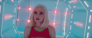 Movie still from “Zombies 3” (2022), directed by Paul Hoen – A woman with blonde hair wearing a red shirt; Close Up shot, Over the shoulder angle