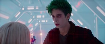 Movie still from “Zombies 3” (2022), directed by Paul Hoen – A young man with green hair looking into the distance; Close Up shot, Over the shoulder angle
