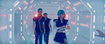 Movie still from “Zombies 3” (2022), directed by Paul Hoen – A group of young people in a futuristic setting; Medium shot, Low angle