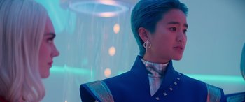 Movie still from “Zombies 3” (2022), directed by Paul Hoen – A person with blue hair and a blue jacket; Close Up shot, Low angle