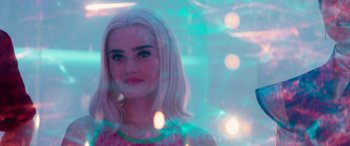 Movie still from “Zombies 3” (2022), directed by Paul Hoen – A woman with white hair and a pink dress; Close Up shot, Over the shoulder angle