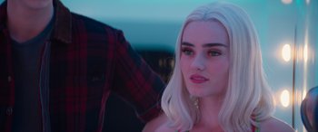 Movie still from “Zombies 3” (2022), directed by Paul Hoen – A person with long white hair; Close Up shot, Over the shoulder angle