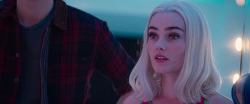 Movie still from “Zombies 3” (2022), directed by Paul Hoen – A woman with white hair and a plaid shirt; Close Up shot, Over the shoulder angle