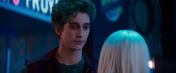 Movie still from “Zombies 3” (2022), directed by Paul Hoen – A young man with green hair looking at a young woman; Close Up shot, Over the shoulder angle