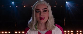 Movie still from “Zombies 3” (2022), directed by Paul Hoen – A person with long white hair; Close Up shot, Over the shoulder angle