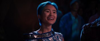 Movie still from “Zombies 3” (2022), directed by Paul Hoen – A woman with blue hair is smiling for the camera; Close Up shot, Low angle