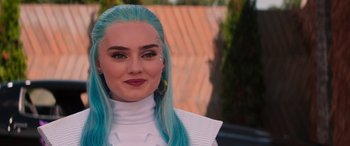 Movie still from “Zombies 3” (2022), directed by Paul Hoen – A person with long blue hair; Close Up shot, Over the shoulder angle