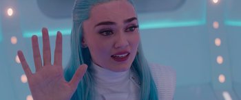 Movie still from “Zombies 3” (2022), directed by Paul Hoen – A person with blue hair; Close Up shot, Over the shoulder angle