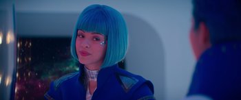 Movie still from “Zombies 3” (2022), directed by Paul Hoen – A person with blue hair and a blue jacket; Close Up shot, Over the shoulder angle