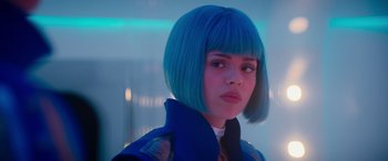 Movie still from “Zombies 3” (2022), directed by Paul Hoen – A woman with blue hair is looking at the camera; Close Up shot, Low angle