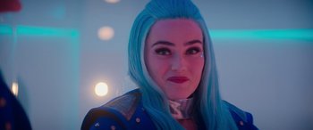 Movie still from “Zombies 3” (2022), directed by Paul Hoen – A woman with blue hair is posing for a picture; Close Up shot, Over the shoulder angle