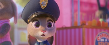 Movie still from “Zootopia” (2016), directed by Jared Bush – A cartoon character in a police uniform; Close Up shot, Over the shoulder angle