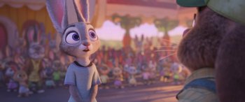 Movie still from “Zootopia” (2016), directed by Jared Bush – A group of people in a room with a bunny rabbit; Medium shot, Over the shoulder angle