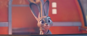 Movie still from “Zootopia” (2016), directed by Jared Bush – A bunny rabbit is holding a pencil in his ear; Close Up shot, Over the shoulder angle