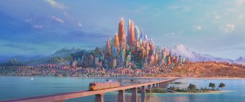 Movie still from “Zootopia” (2016), directed by Jared Bush – A train traveling across a bridge over a river; Extreme Wide shot, High angle