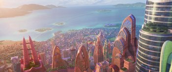 Movie still from “Zootopia” (2016), directed by Jared Bush – An aerial view of a city with buildings and water in the background; Extreme Wide shot, High angle