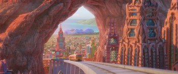 Movie still from “Zootopia” (2016), directed by Jared Bush – A train is traveling through a tunnel in a city; Extreme Wide shot, Low angle