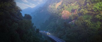 Movie still from “Zootopia” (2016), directed by Jared Bush – A train traveling over a bridge in the middle of a forest; Extreme Wide shot, Low angle