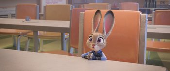 Movie still from “Zootopia” (2016), directed by Jared Bush – A bunny rabbit sitting at a table in a restaurant; Medium shot, High angle