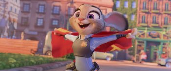 Movie still from “Zootopia” (2016), directed by Jared Bush – A cartoon of a mouse with a red cape; Medium shot, Low angle