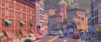 Movie still from “Zootopia” (2016), directed by Jared Bush – An animated picture of a city with cars driving down the street; Extreme Wide shot, High angle