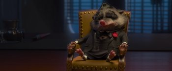 Movie still from “Zootopia” (2016), directed by Jared Bush – A stuffed animal sitting on top of a brown chair; Medium shot, High angle
