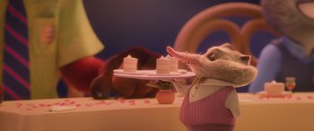 Movie still from “Zootopia” (2016), directed by Jared Bush – A stuffed animal holding a plate of cake; Medium shot, Low angle