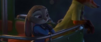 Movie still from “Zootopia” (2016), directed by Jared Bush – A bunny rabbit is looking over a railing; Close Up shot, Over the shoulder angle