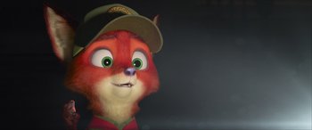 Movie still from “Zootopia” (2016), directed by Jared Bush – A furry animal wearing a baseball cap and looking at the camera; Close Up shot, Over the shoulder angle