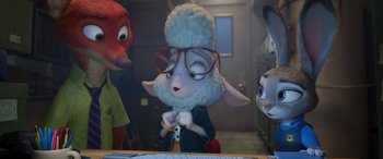 Movie still from “Zootopia” (2016), directed by Jared Bush – A group of animals that are standing in front of a computer; Medium shot, High angle